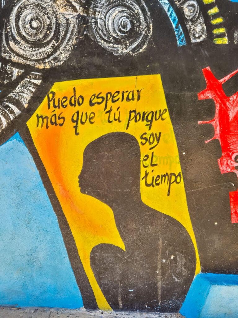 Mural: "Ich kann länger warten als du, denn ich bin die Zeit."